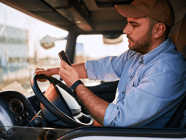 Service driver reviewing a smart route on a phone before heading out