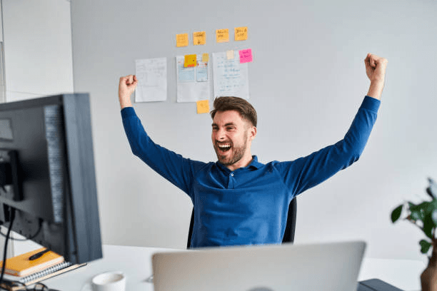 Business owner feeling on top of work at the desk